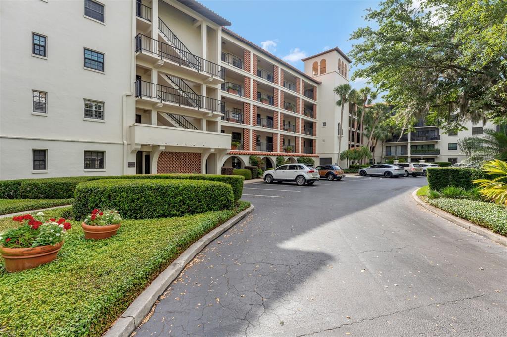 100 South Interlachen Avenue, Unit 410F Winter Park, FL 32789 - Photo 10 of 38 a building with cars parked in front of it