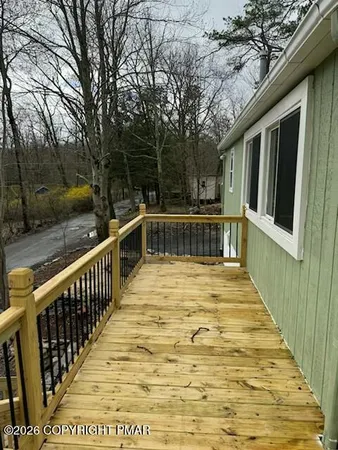 a view of a swimming pool with deck
