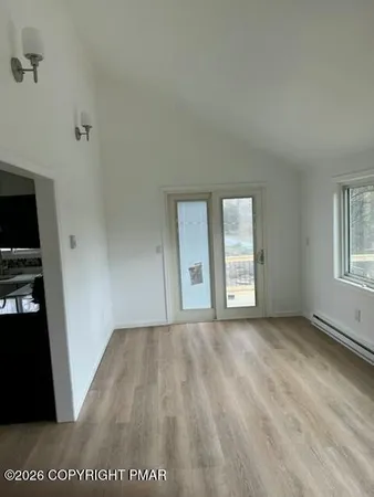 a view of an empty room with a window