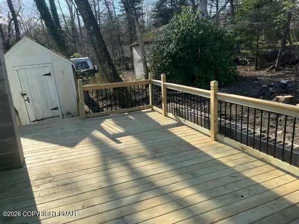 a view of a balcony with wooden floor