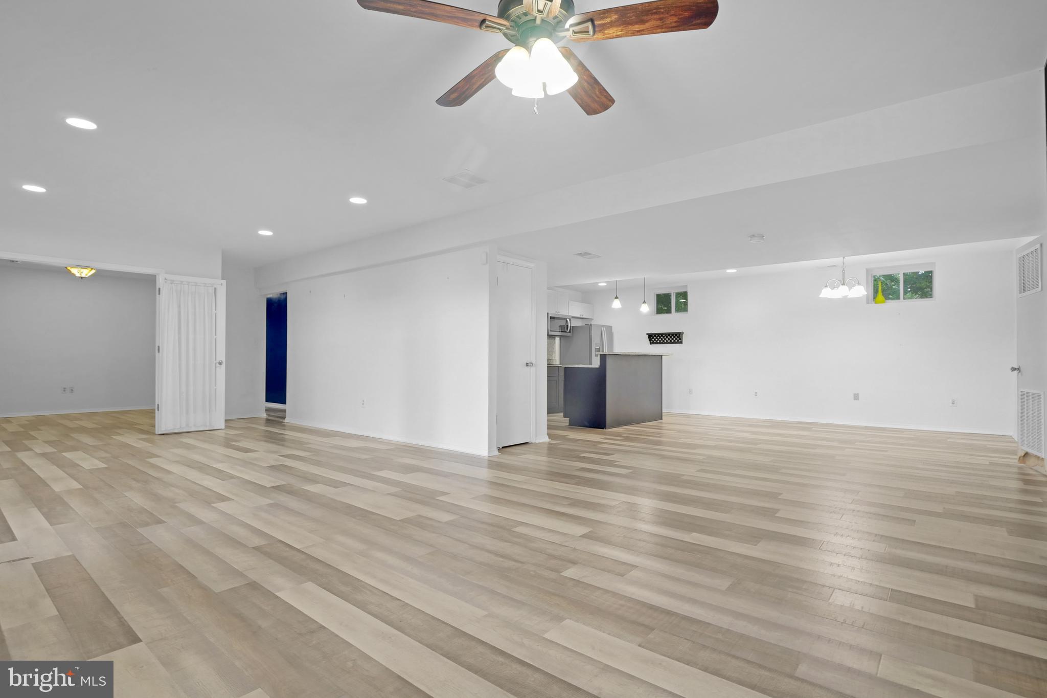 3223 Riverview Drive Triangle, VA 22172 - Photo 40 of 81 Lower Level Family Room, Dining Area, and Kitchen