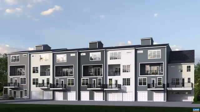 a front view of residential houses with street