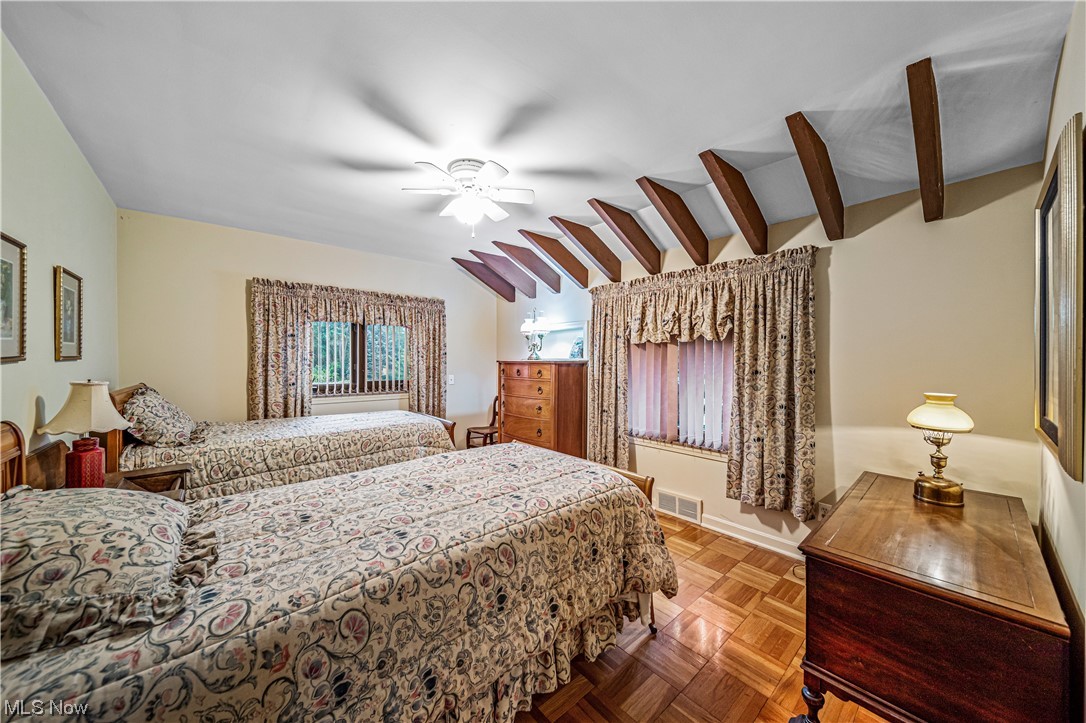 35510 Ridge Road Willoughby, OH 44094 - Photo 19 of 35 Bedroom featuring vaulted ceiling with beams, parquet floors, and ceiling fan