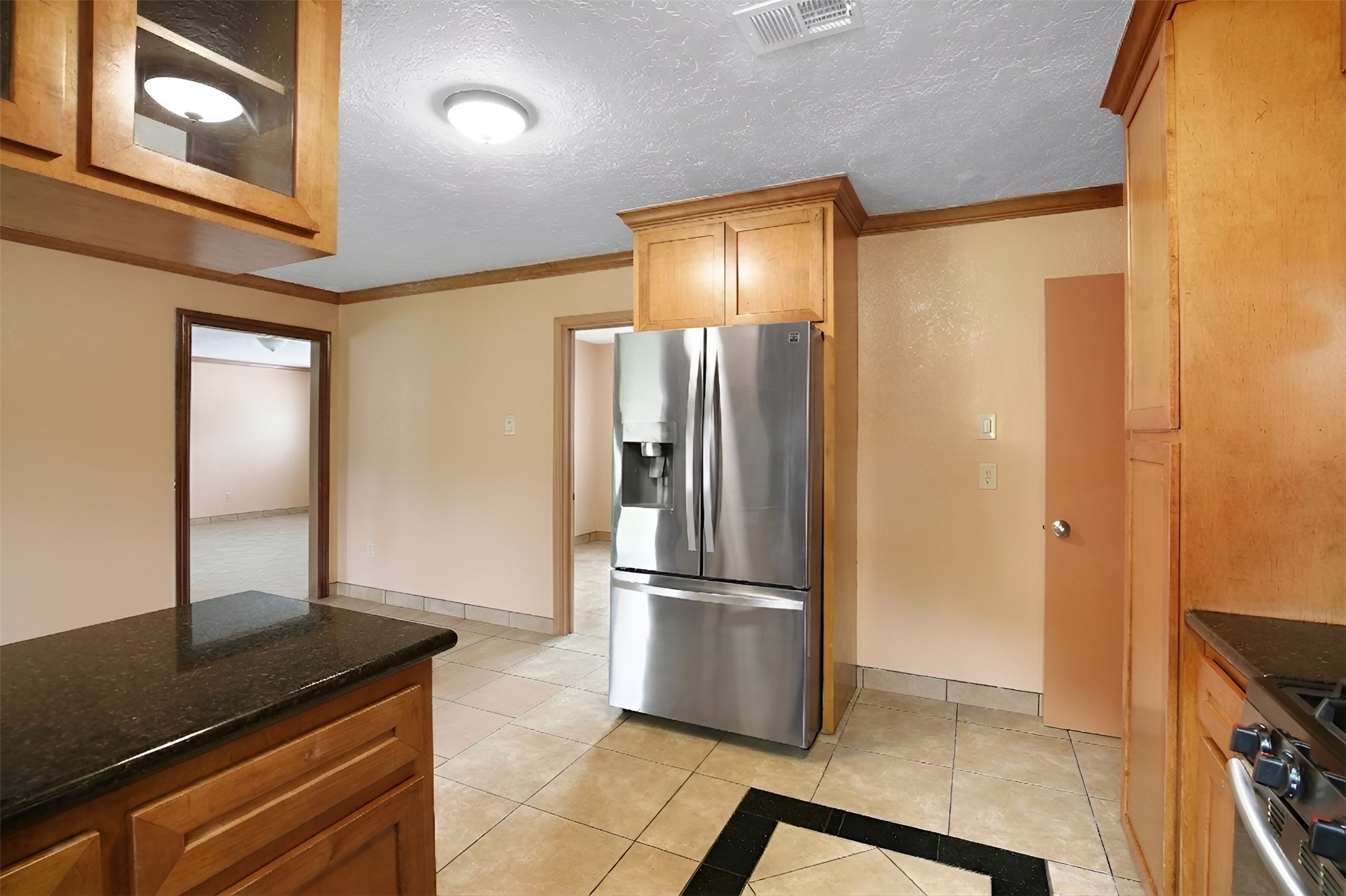 6923 Leader Street Houston, TX 77074 - Photo 12 of 19 a kitchen with stainless steel appliances granite countertop a refrigerator and a stove