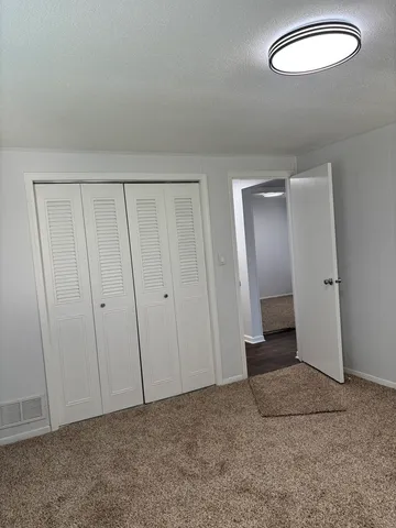 an empty room with a bench