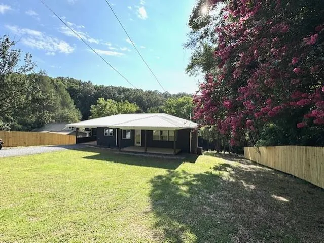 a view of a house with a yard