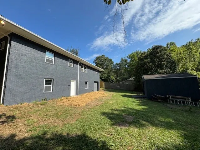 a backyard of a house with lots of green space
