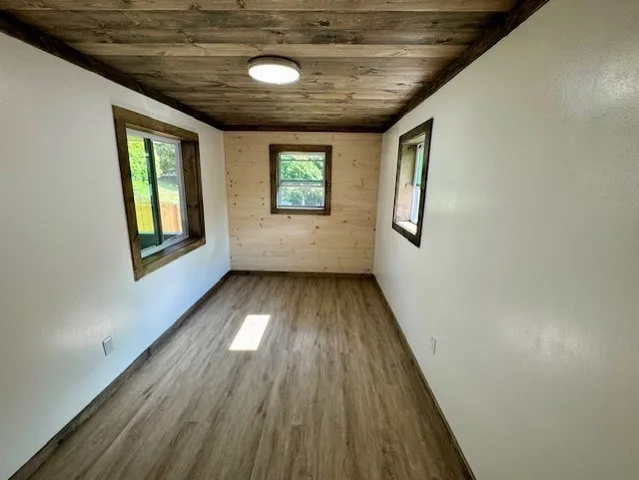 a kitchen with granite countertop a sink stove and cabinets