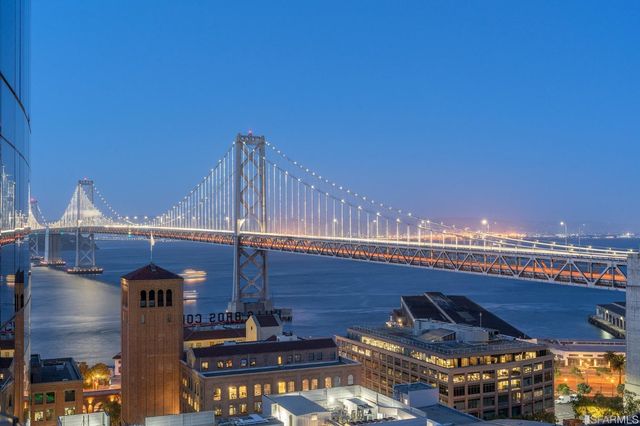 a view of a dining room with furniture and a window