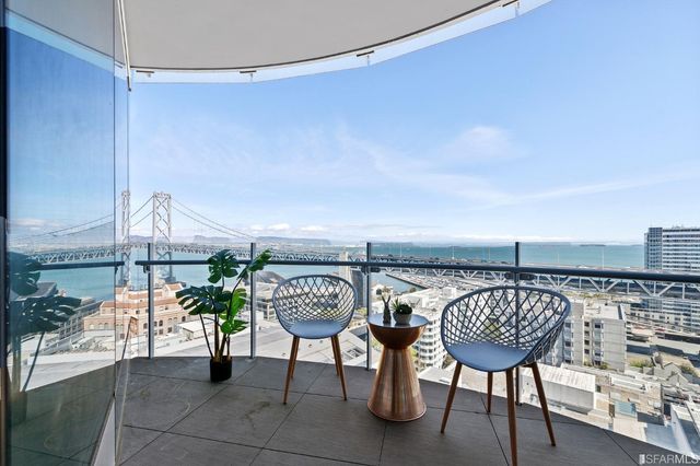 a lobby with furniture and floor to ceiling window