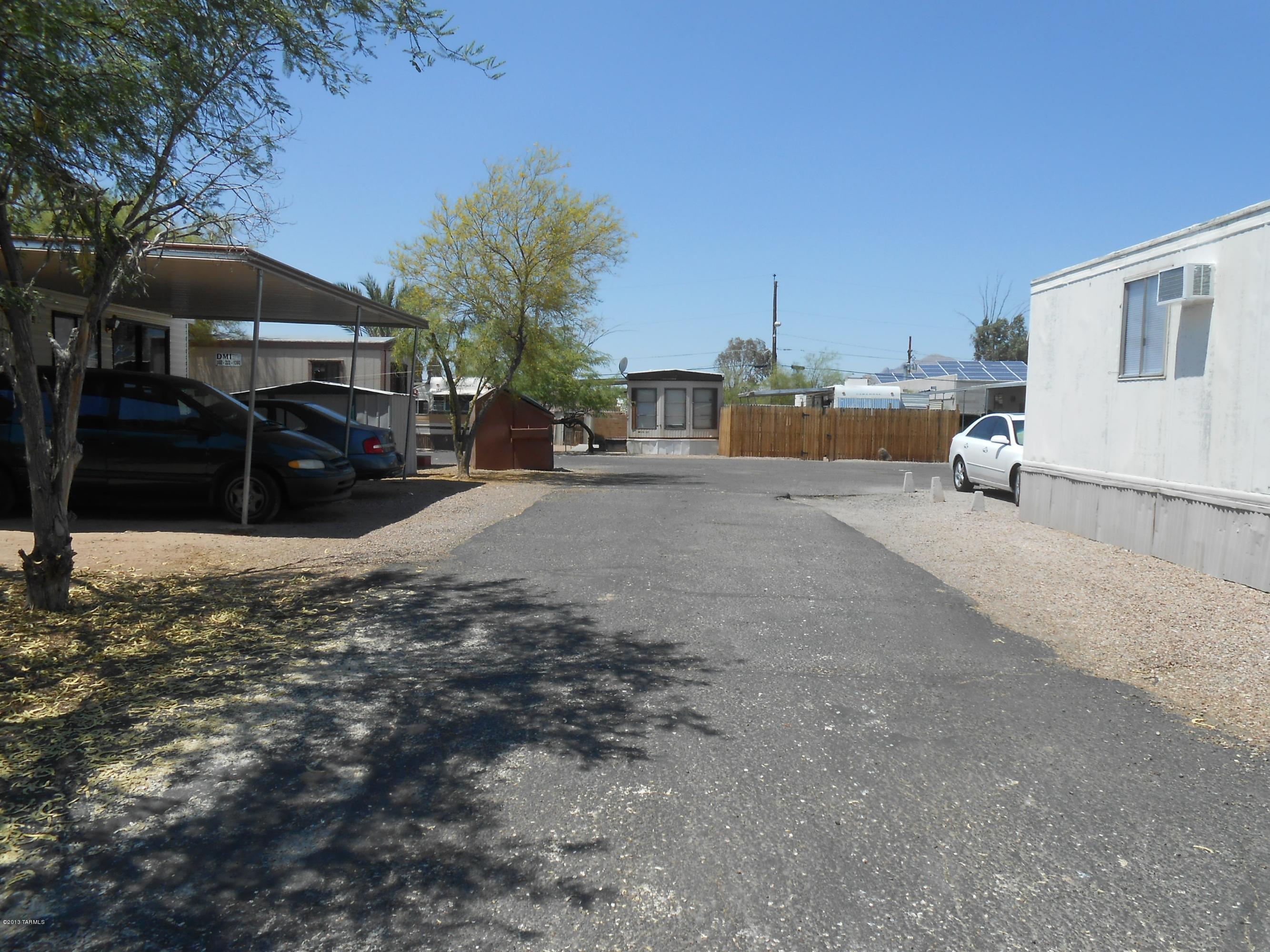 522 West Rillito Street Tucson, AZ 85705 - Photo 13 of 15 a view of a street with a table and chairs under an umbrella