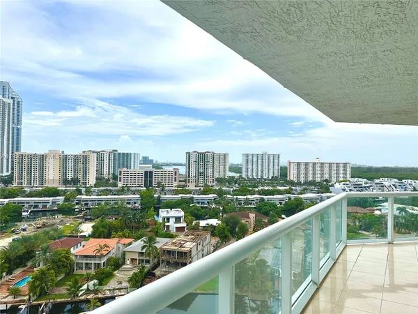 a kitchen with a large window and tall counter space
