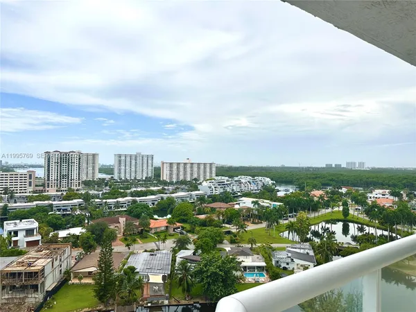 a view of a swimming pool and lounge chairs