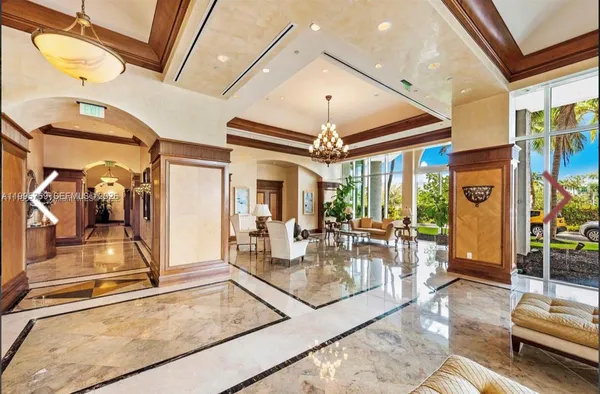 a living room with furniture a flat screen tv and a large window