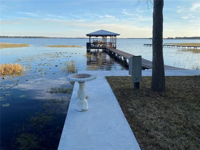 a view of a balcony with wooden floor