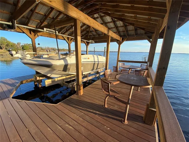 a kitchen with a sink appliances and cabinets