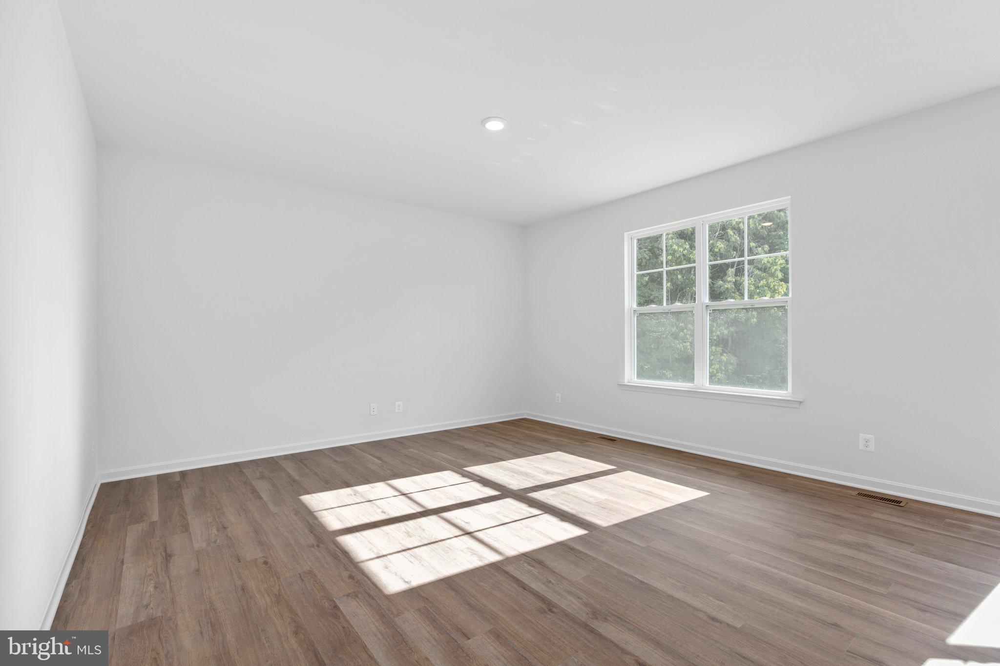 2 Indiantown Road King George, VA 22485 - Photo 12 of 27 an empty room with wooden floor and windows