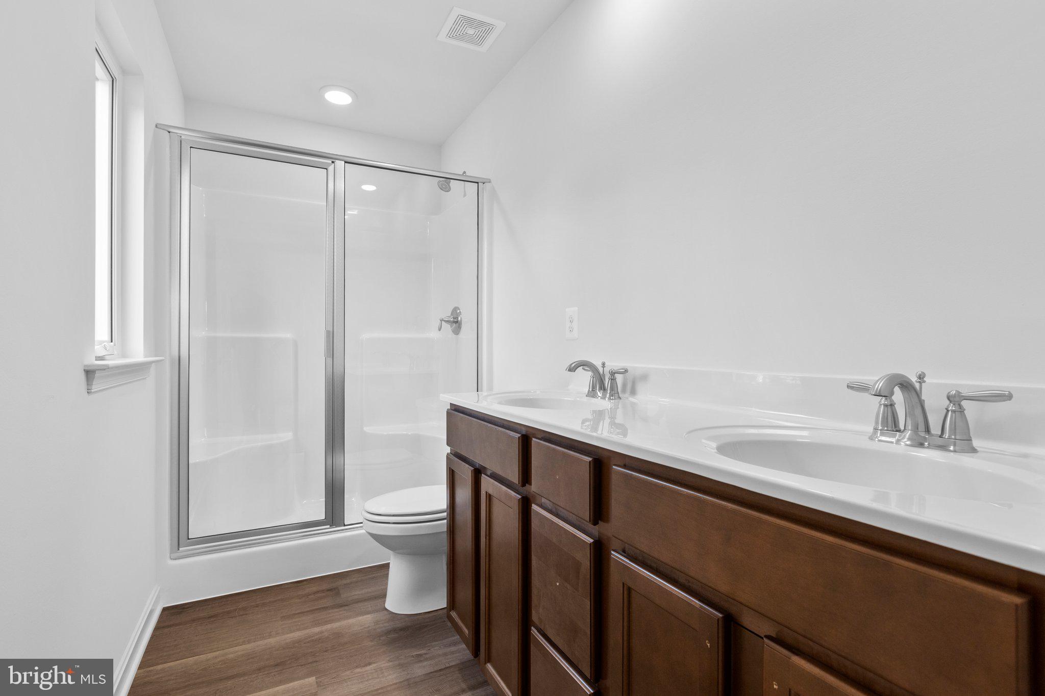 2 Indiantown Road King George, VA 22485 - Photo 16 of 27 a bathroom with a sink a toilet and shower