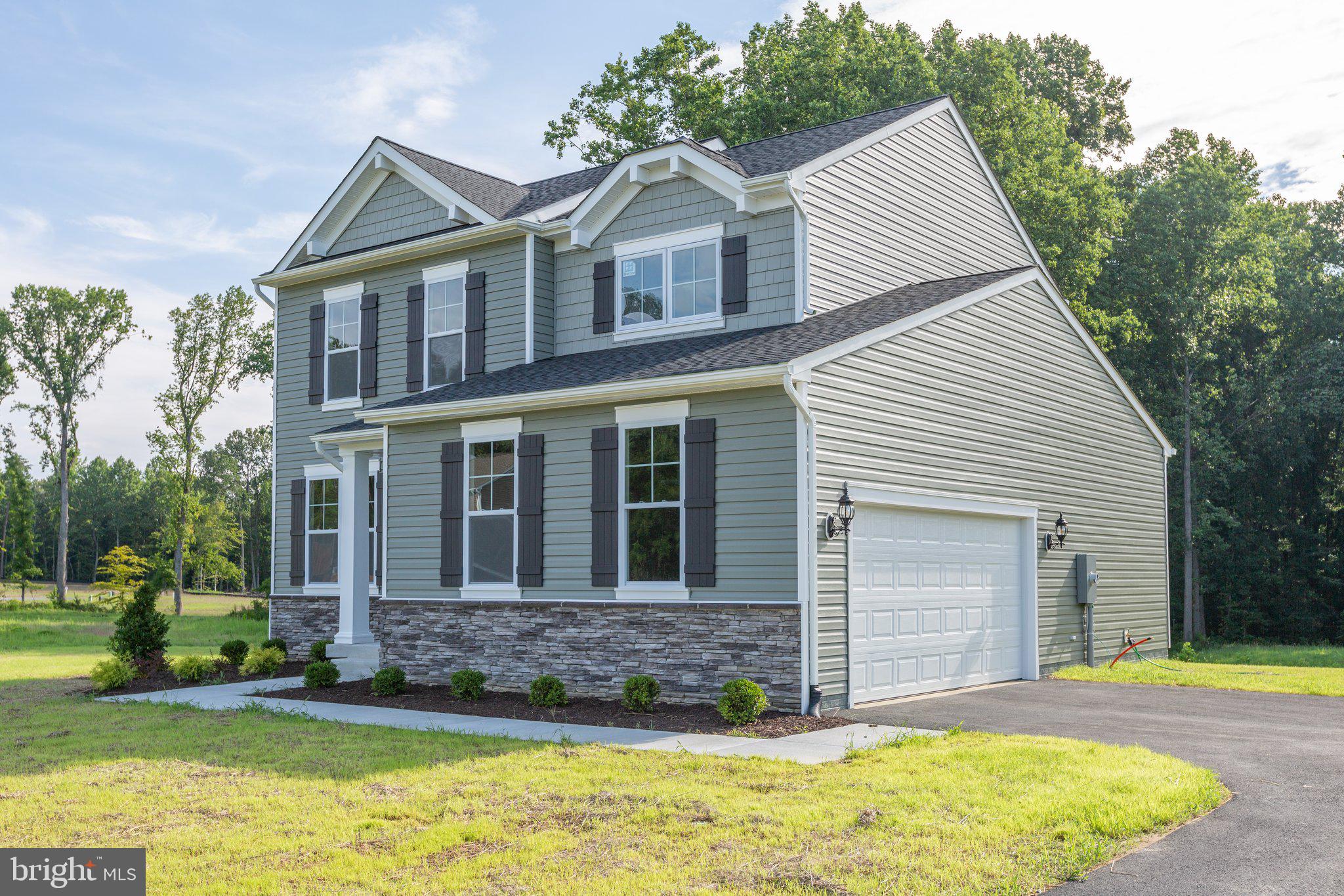 2 Indiantown Road King George, VA 22485 - Photo 3 of 27 a front view of a house with a yard