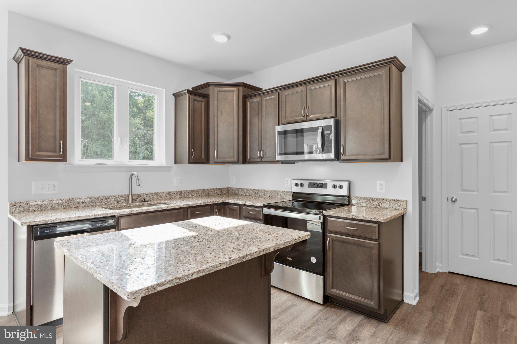 2 Indiantown Road King George, VA 22485 - Photo 4 of 27 a kitchen with stainless steel appliances granite countertop a sink stove and microwave