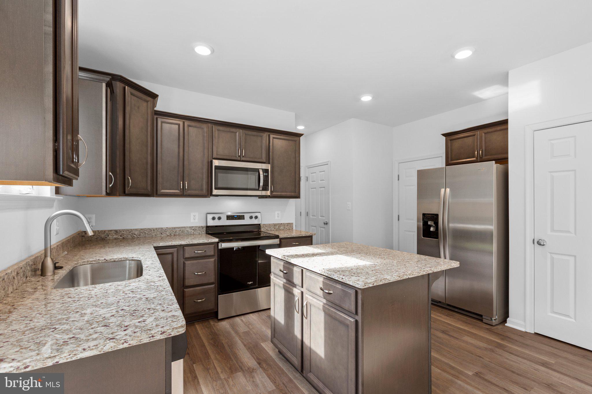 2 Indiantown Road King George, VA 22485 - Photo 7 of 27 a kitchen with a stove sink and refrigerator