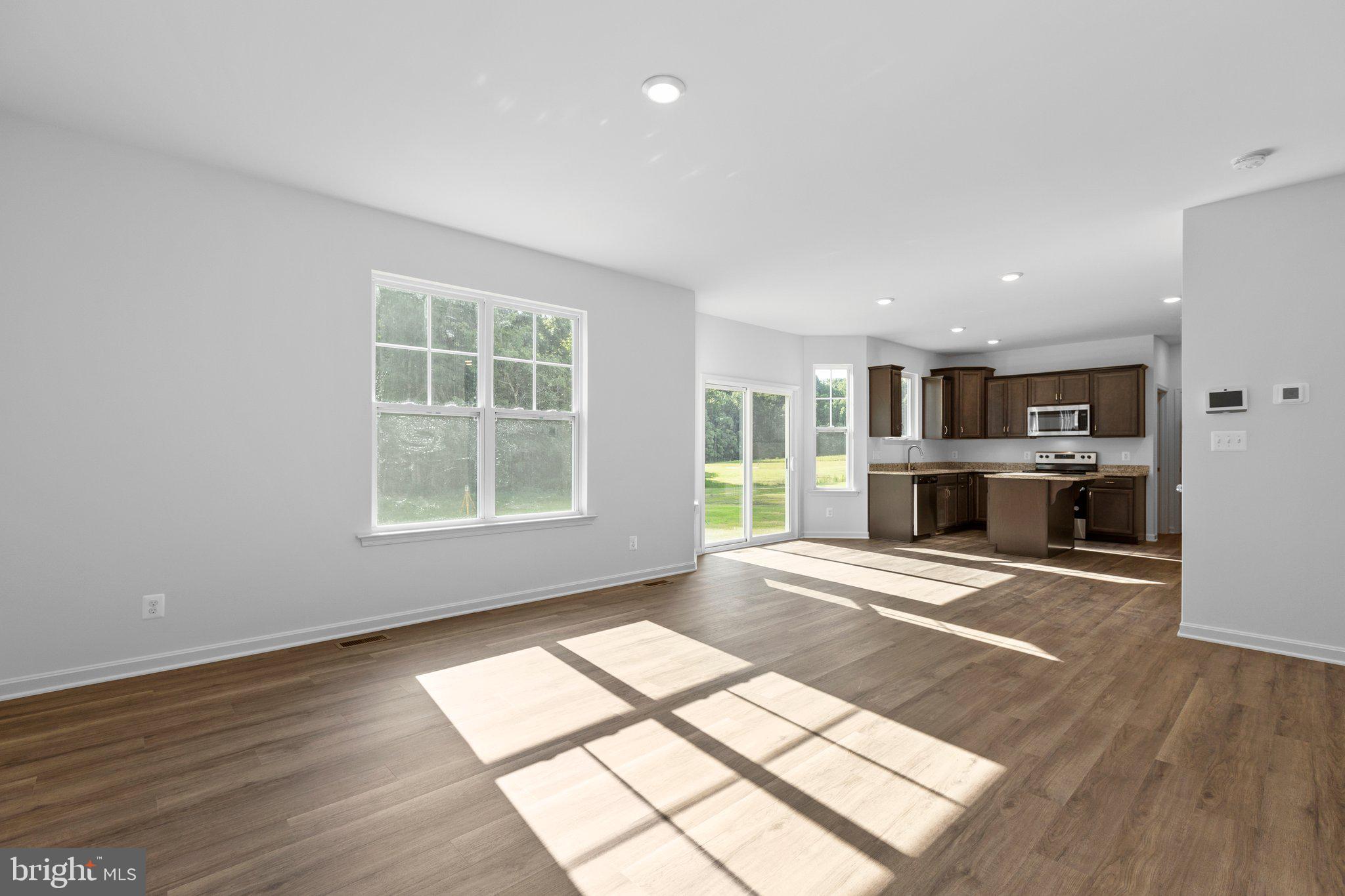 2 Indiantown Road King George, VA 22485 - Photo 10 of 27 a view of a living room with windows and a kitchen