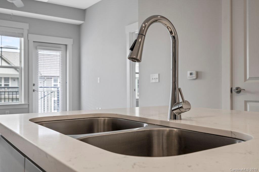 652 Herrons Ferry Road, Unit 419 Rock Hill, SC 29730 - Photo 20 of 36 a view of a sink a faucet a mirror and window in the kitchen