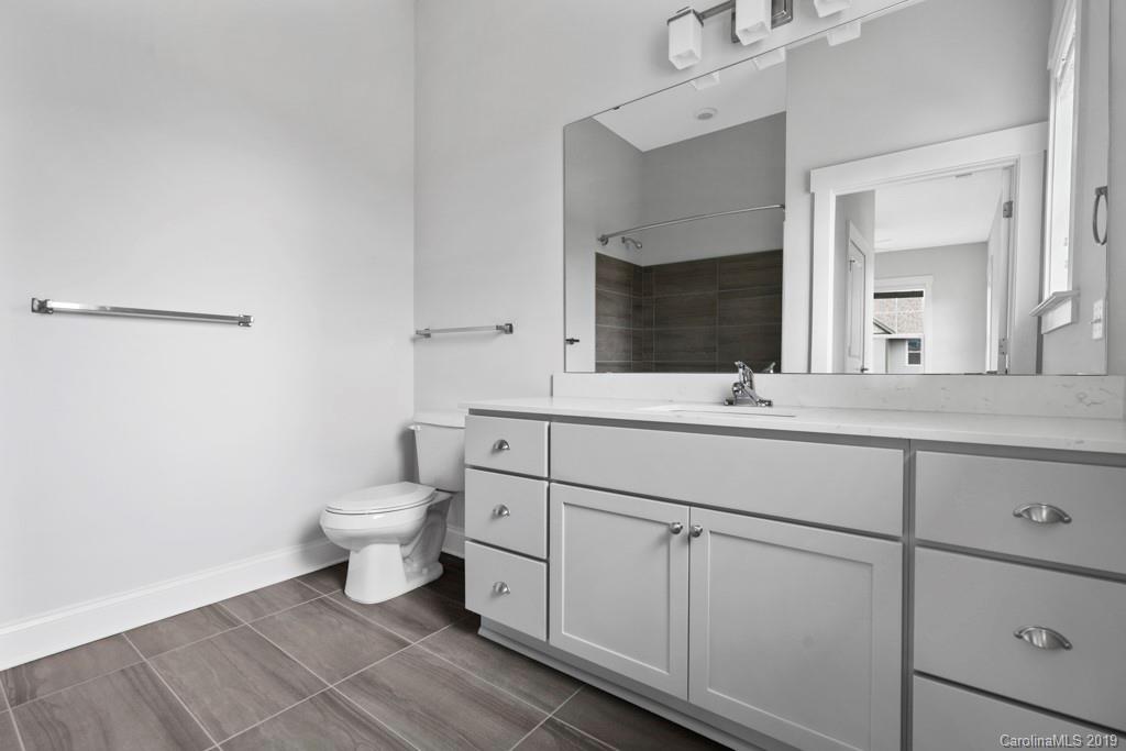 652 Herrons Ferry Road, Unit 419 Rock Hill, SC 29730 - Photo 29 of 36 a bathroom with a toilet sink and mirror
