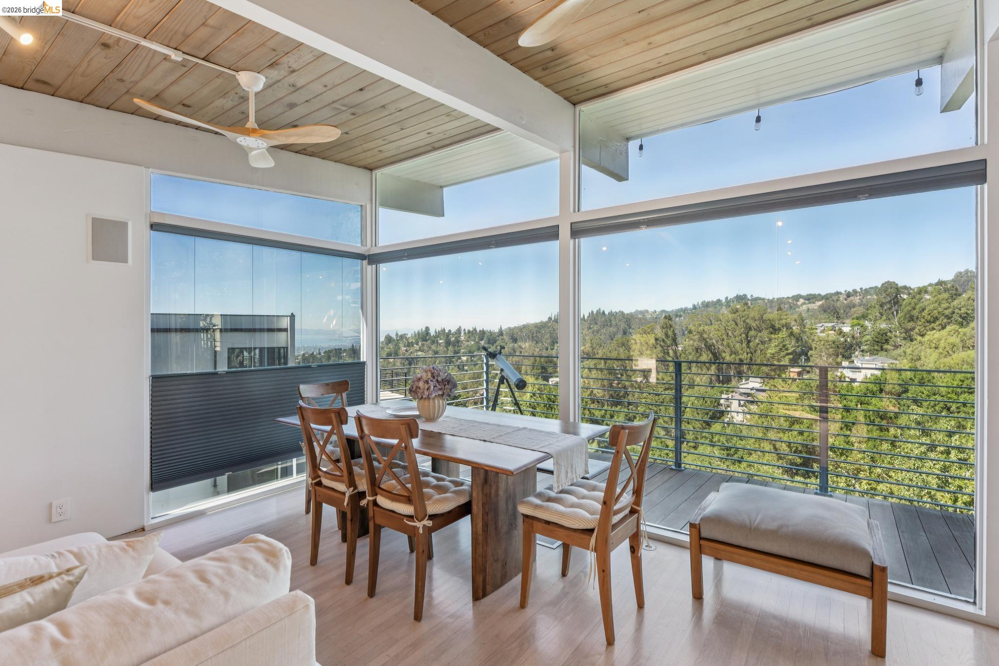 6733 Snake Road Oakland, CA 94611 - Photo 11 of 57 a view of a dining room with furniture window and outside view