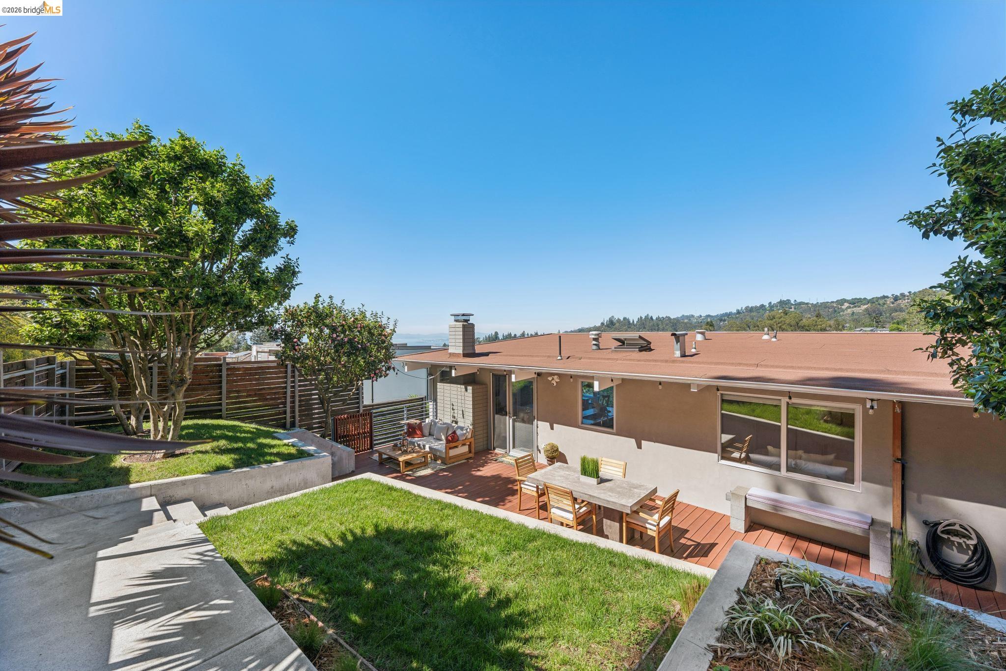 6733 Snake Road Oakland, CA 94611 - Photo 2 of 57 a view of a house with a yard porch and sitting area