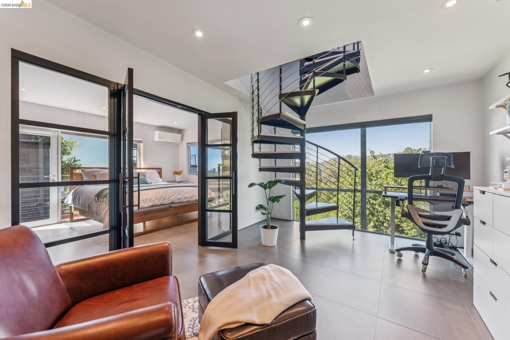 6733 Snake Road Oakland, CA 94611 - Photo 25 of 57 a living room with furniture and a potted plant
