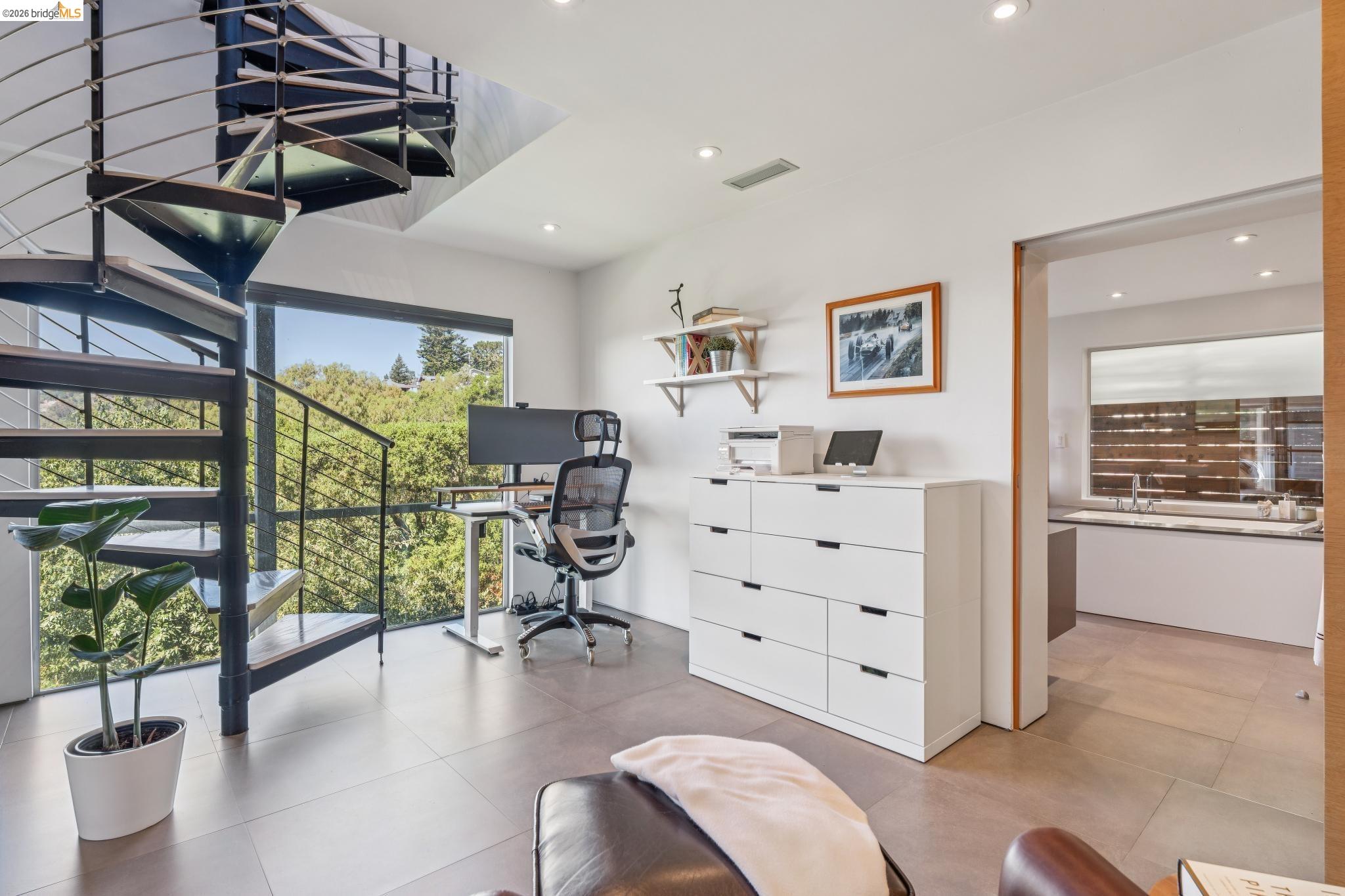 6733 Snake Road Oakland, CA 94611 - Photo 34 of 57 Common area leads to oversized bathroom with pocket doors