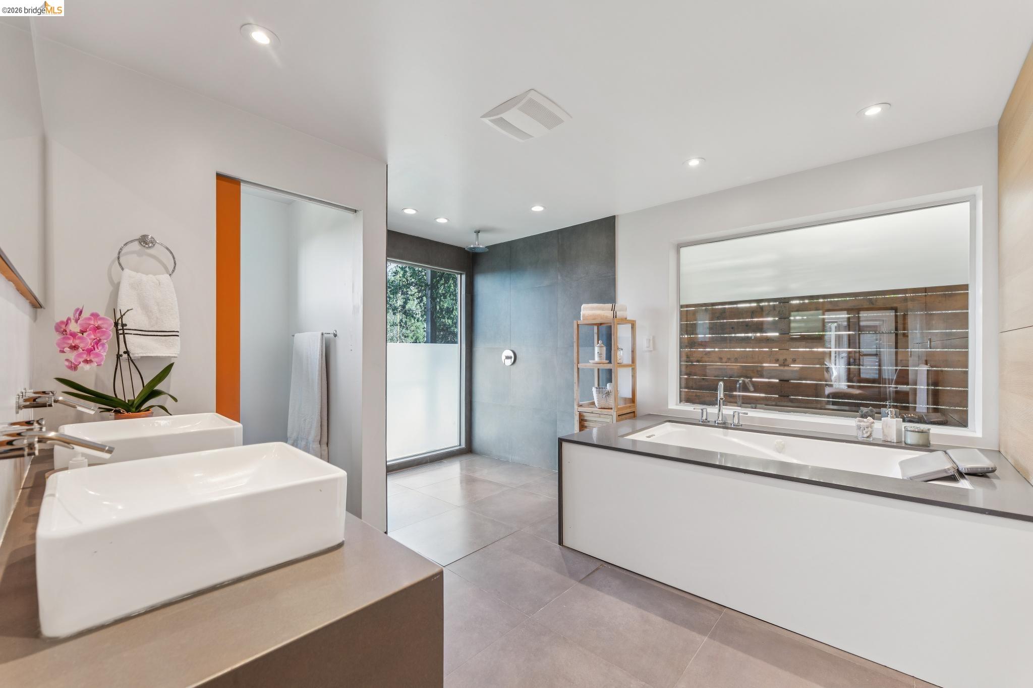 6733 Snake Road Oakland, CA 94611 - Photo 35 of 57 Oversized bathroom with a jetted bath, double vanity, a large walk in shower is your own spa