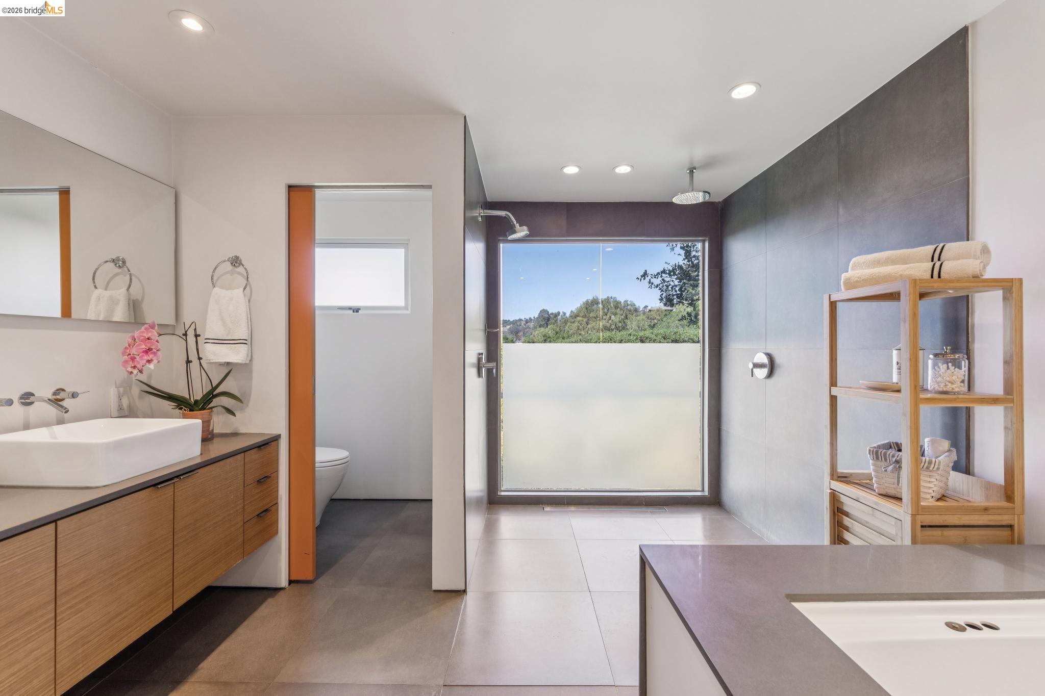 6733 Snake Road Oakland, CA 94611 - Photo 38 of 57 Bathroom with large walk in shower, dual showerheads,recessed lighting, and Italian ceramic tile floors