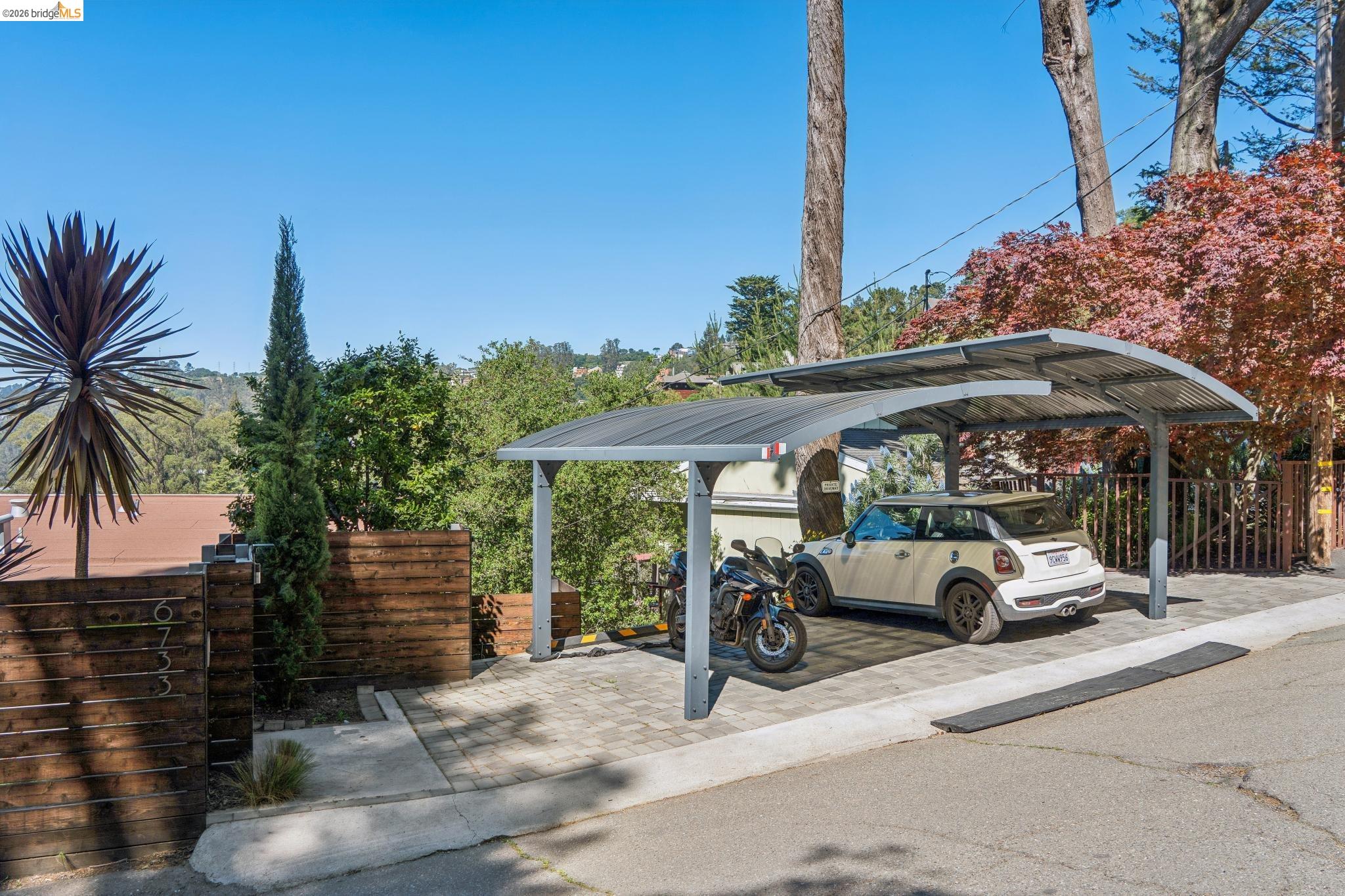 6733 Snake Road Oakland, CA 94611 - Photo 55 of 57 View of parking featuring a stylish modern carport