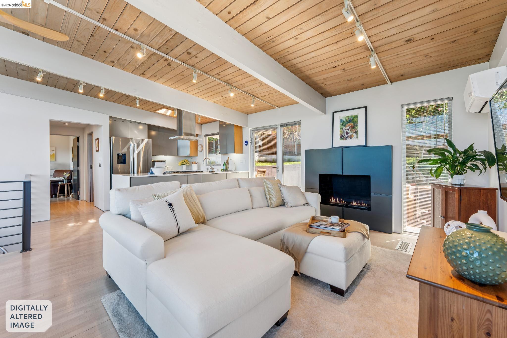 6733 Snake Road Oakland, CA 94611 - Photo 8 of 57 a living room with furniture and a fireplace