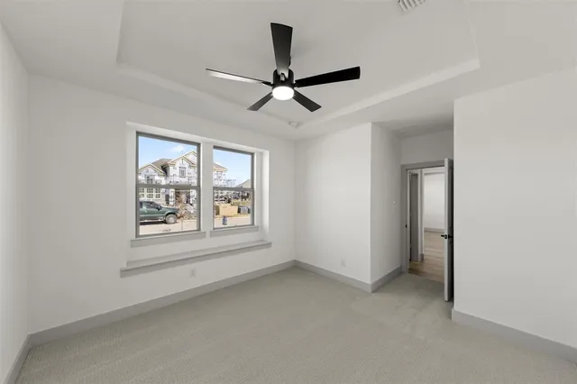 a view of kitchen with kitchen island and stainless steel appliances