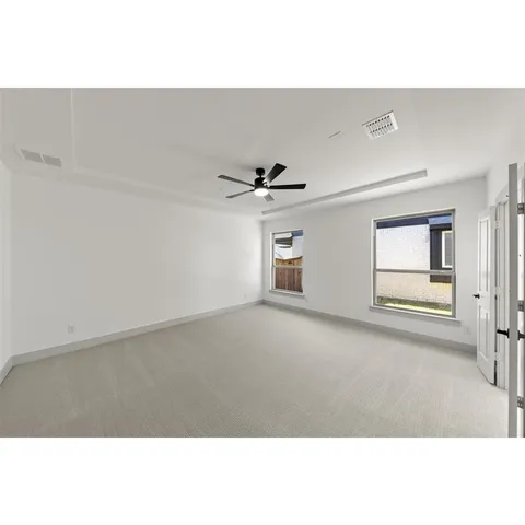 a bathroom with a tub sink shower and mirror