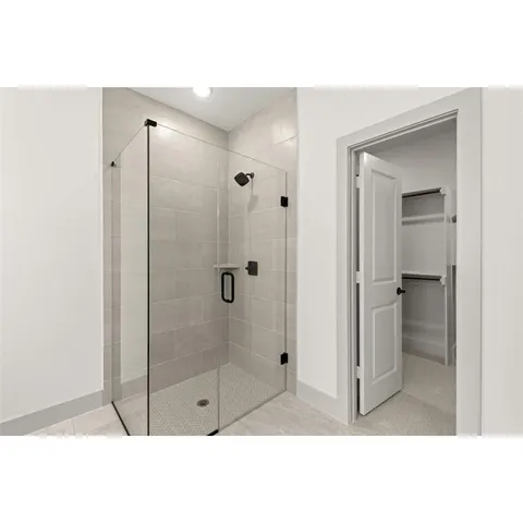 a spacious bathroom with a double vanity sink mirror and bathtub
