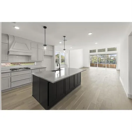 a kitchen with kitchen island cabinets and window