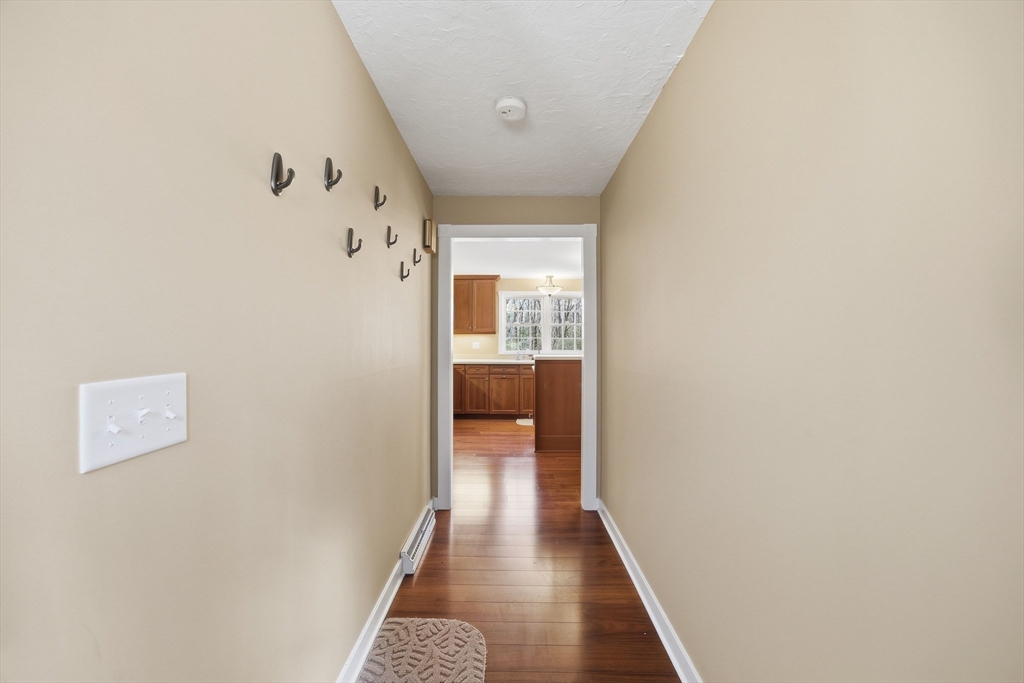 200 Nashua Road Groton, MA 01450 - Photo 11 of 41 a view of a hallway with wooden floor