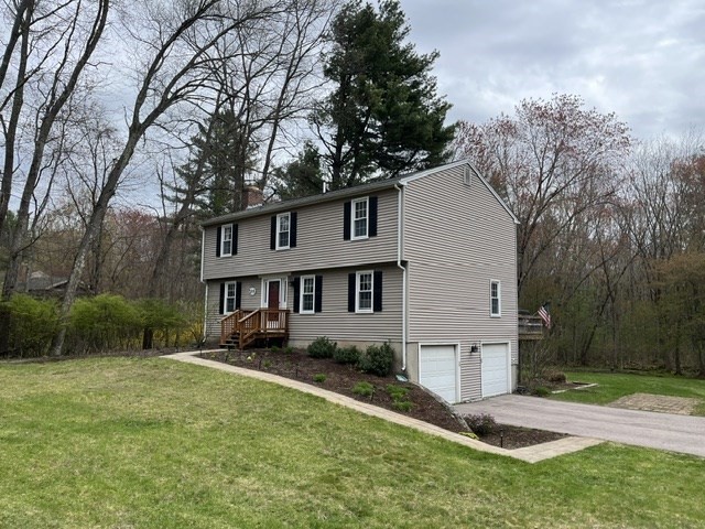 200 Nashua Road Groton, MA 01450 - Photo 2 of 41 a front view of a house with a yard and trees