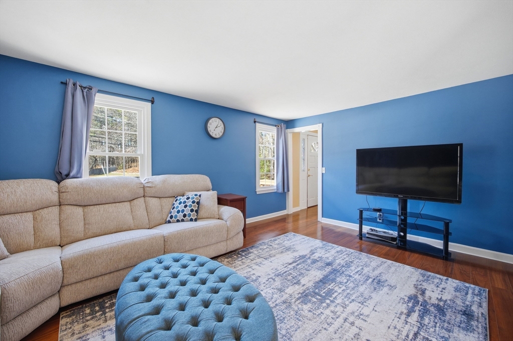200 Nashua Road Groton, MA 01450 - Photo 23 of 41 a living room with furniture and a flat screen tv