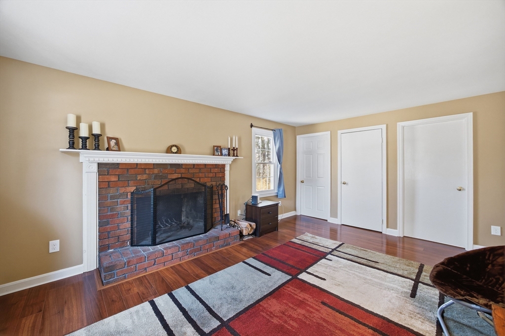 200 Nashua Road Groton, MA 01450 - Photo 24 of 41 a living room with furniture and a fireplace