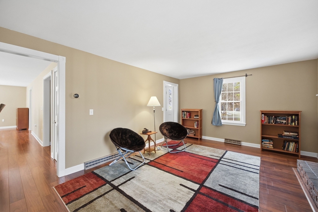 200 Nashua Road Groton, MA 01450 - Photo 26 of 41 a living room with furniture and wooden floor