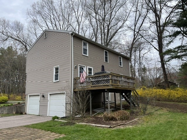 200 Nashua Road Groton, MA 01450 - Photo 3 of 41 a view of a house with a yard chairs and fire pit