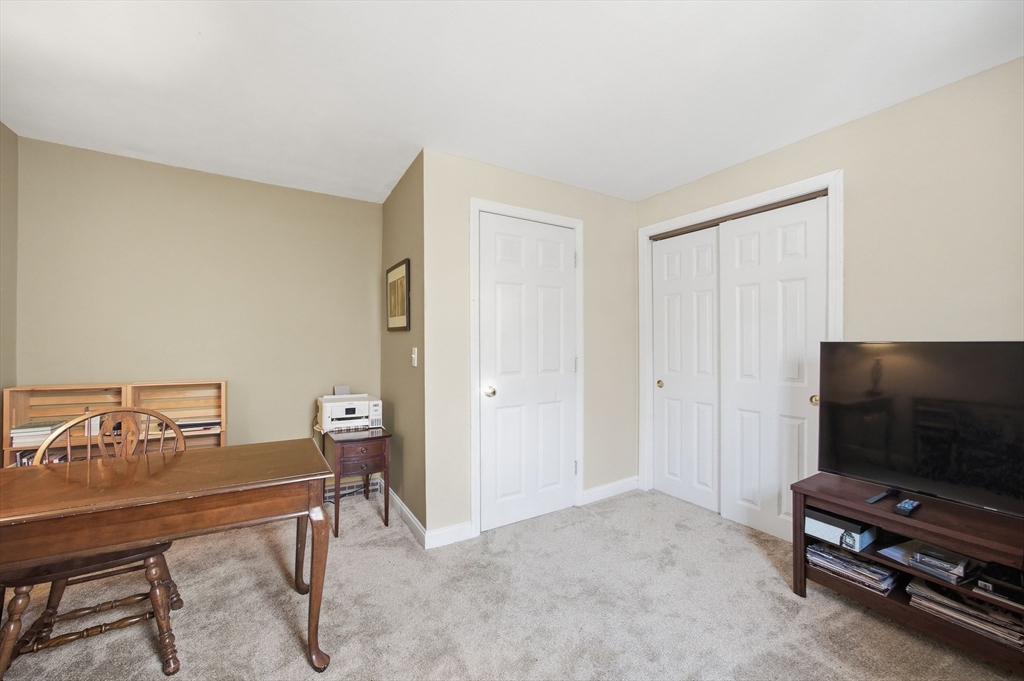 200 Nashua Road Groton, MA 01450 - Photo 34 of 41 a view of a livingroom with furniture and a flat screen tv