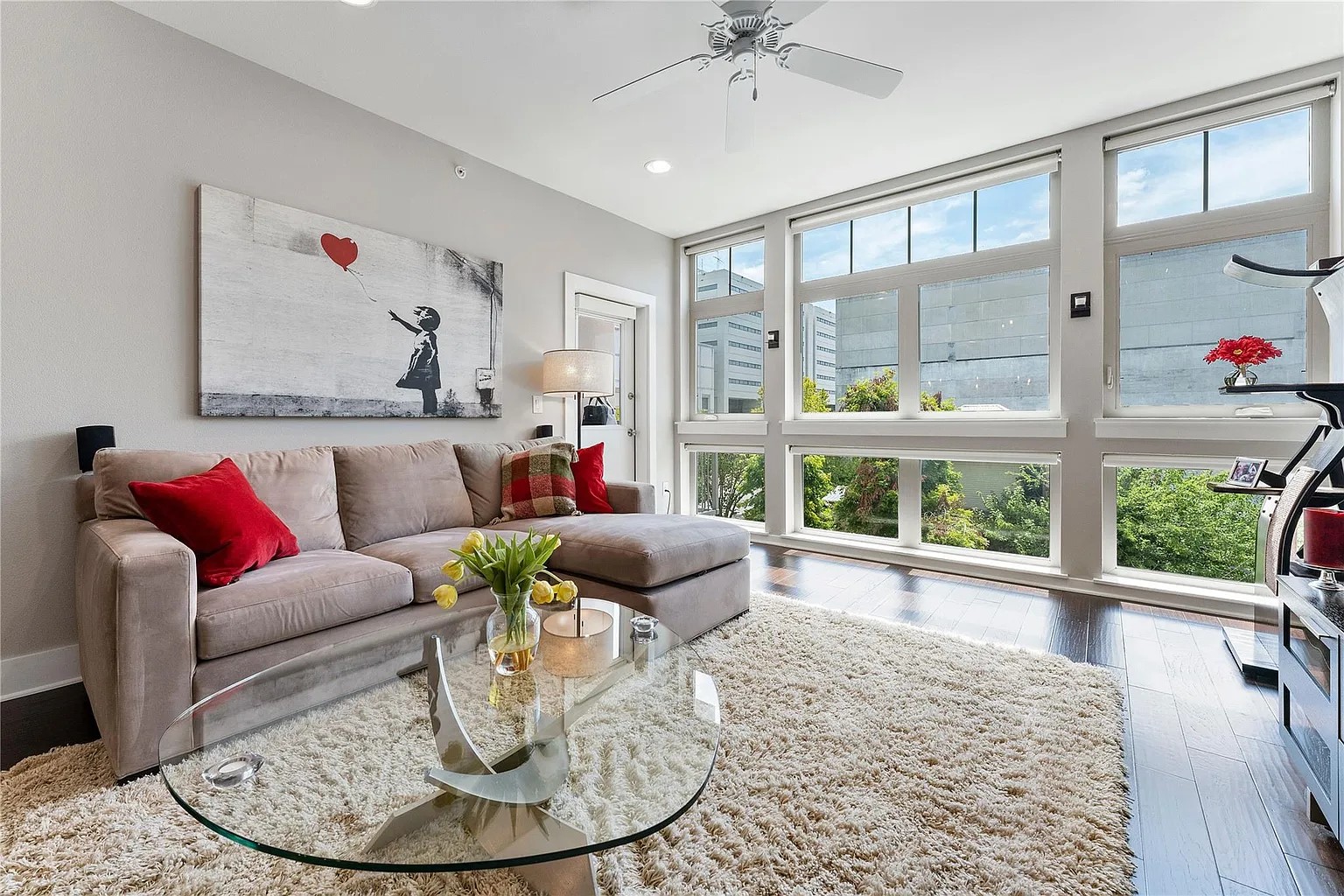908 Nueces Street, Unit 31 Austin, TX 78701 - Photo 1 of 32 a living room with furniture and a large window