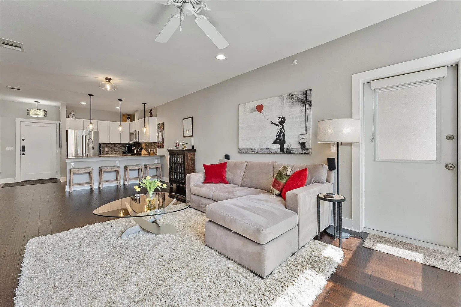908 Nueces Street, Unit 31 Austin, TX 78701 - Photo 15 of 32 a living room with furniture and a wooden floor
