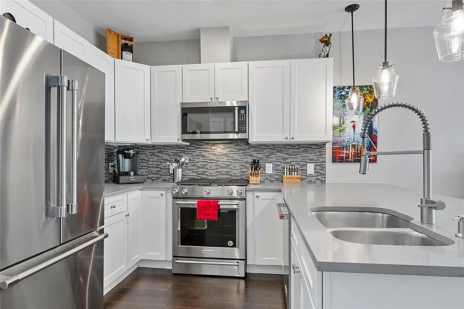 908 Nueces Street, Unit 31 Austin, TX 78701 - Photo 2 of 32 a kitchen with stainless steel appliances granite countertop a sink stove and refrigerator